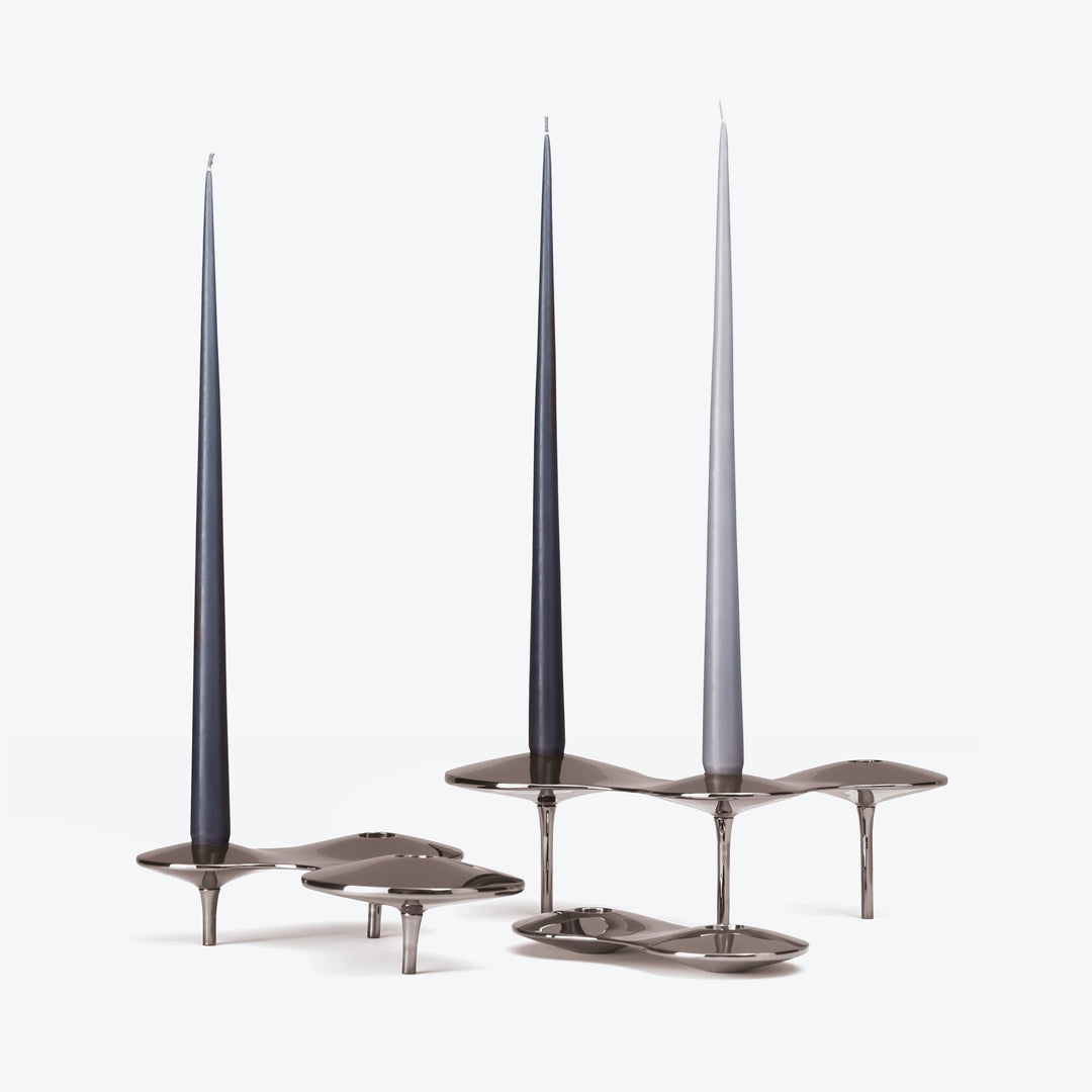 Tapered Candle, Set of 4 — dark and light grey candles in polished silver-tone Cell Candle Holders on white