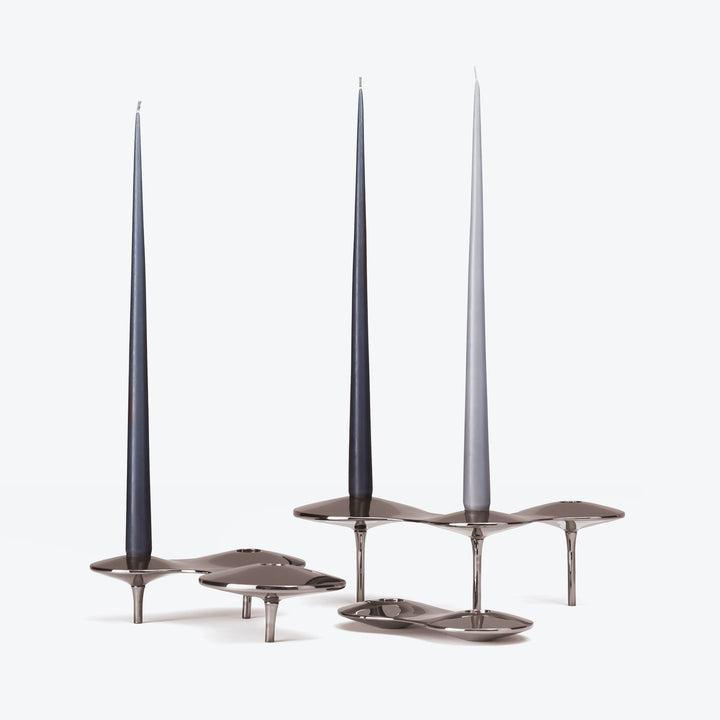 Tapered Candle, Set of 4 — dark and light grey candles in polished silver-tone Cell Candle Holders on white