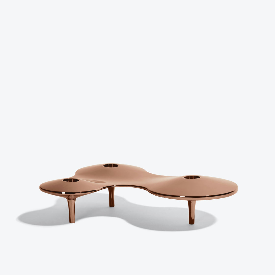 Cell Candle Holder — medium rose gold three-candle piece on short legs, low side view on white