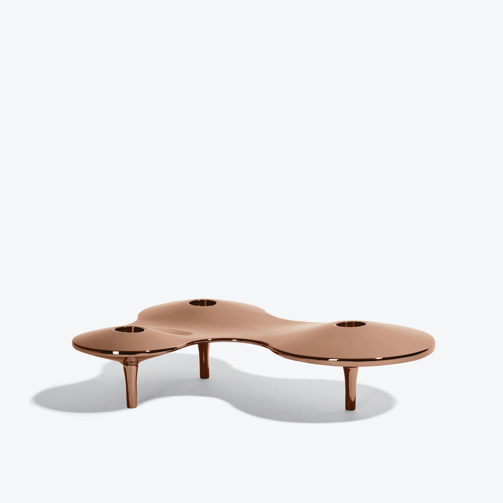 Cell Candle Holder — medium rose gold three-candle piece on short legs, low side view on white