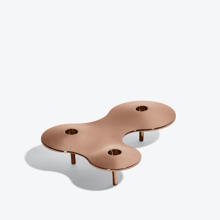 Cell Candle Holder — medium rose gold three-candle piece on short legs, three-quarter view from above