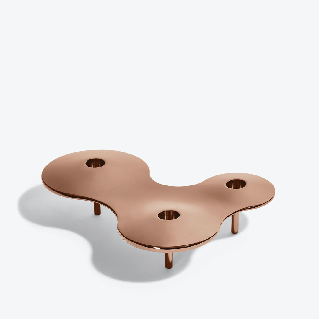 Cell Candle Holder — medium rose gold three-candle piece, alternate angle from above showing its curved outline
