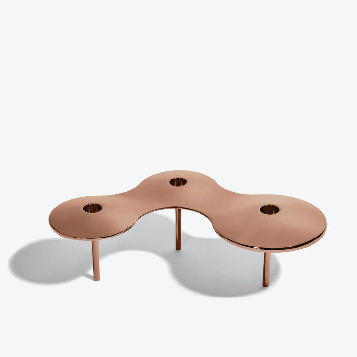 Cell Candle Holder — large rose gold three-candle piece on tall legs, front three-quarter view