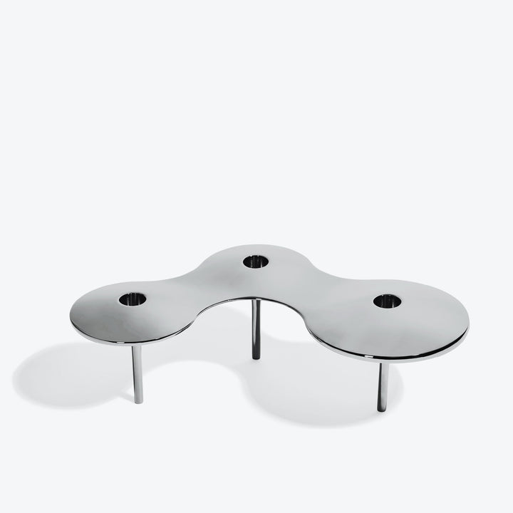 Cell Candle Holder — large silver three-candle piece on tall legs, front three-quarter view