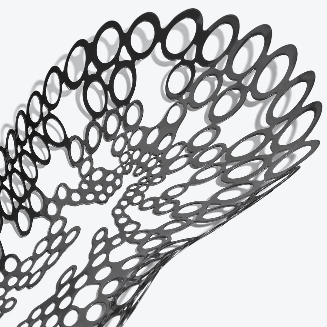 Cell Centerpiece — close-up of the black perforated cell pattern and its shadows