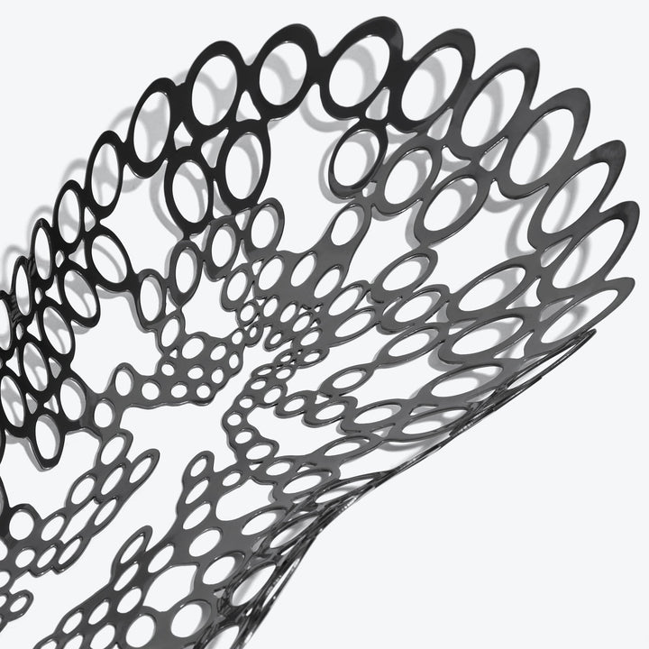 Cell Centerpiece — close-up of the black perforated cell pattern and its shadows