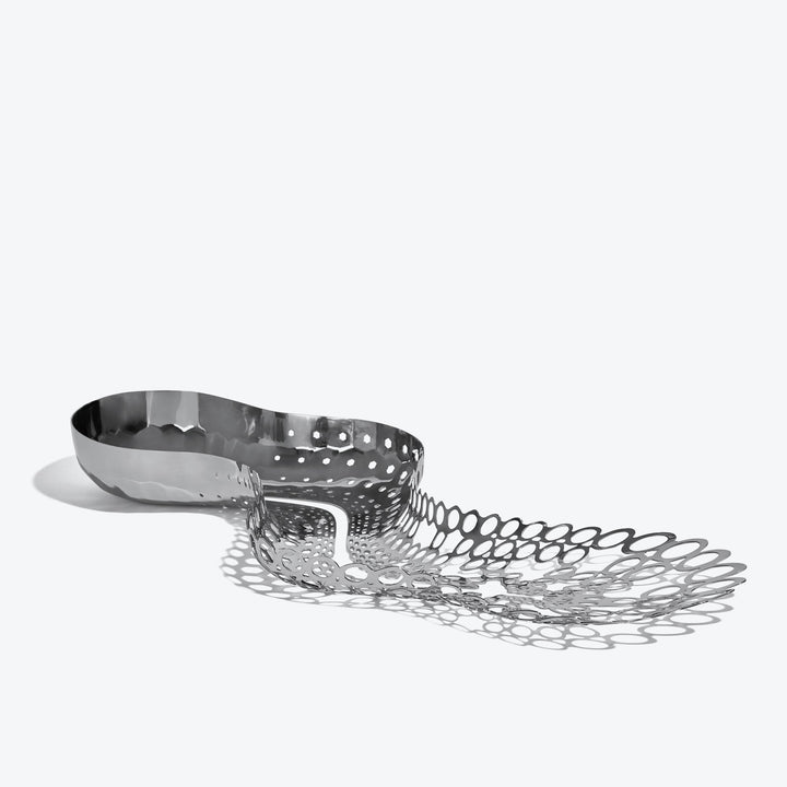 Cell Centerpiece — polished silver stainless steel centerpiece, three-quarter view from the bowl end