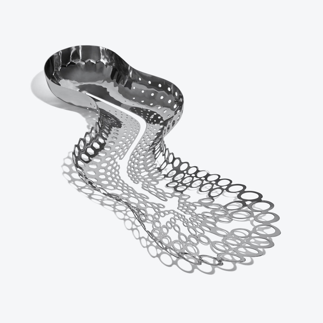 Cell Centerpiece — polished silver centerpiece seen from above, bowl tapering into open cells