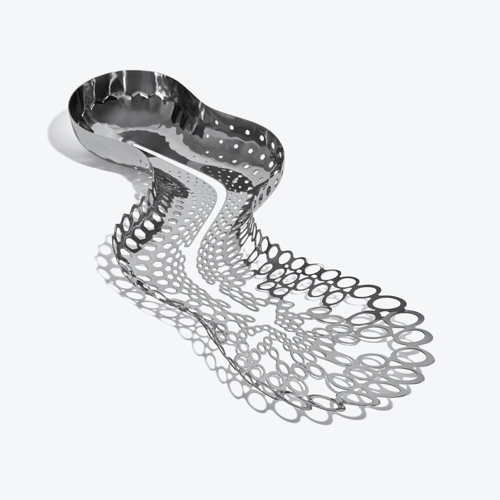 Cell Centerpiece — polished silver centerpiece seen from above, bowl tapering into open cells
