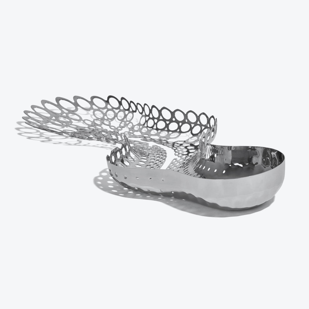 Cell Centerpiece — polished silver centerpiece viewed from the perforated end on a white background