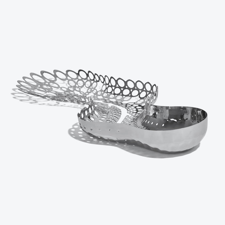 Cell Centerpiece — polished silver centerpiece viewed from the perforated end on a white background
