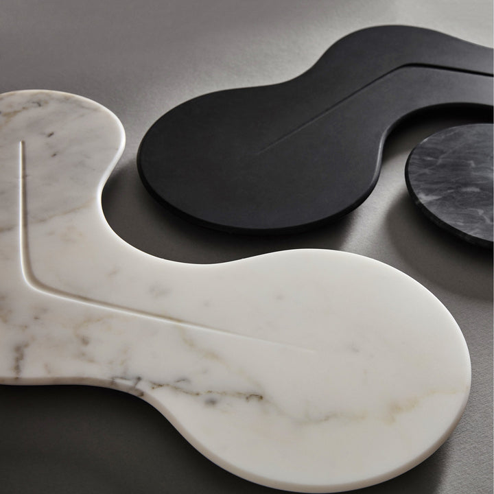 Cell Platter — white and black marble platters overlapping on a dark surface