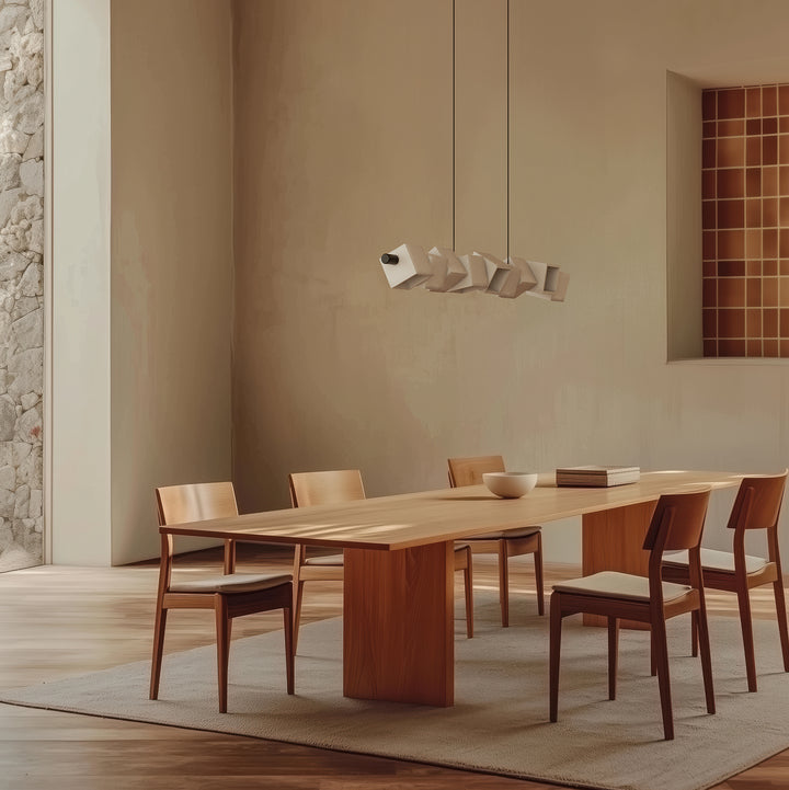 Dining area with wooden table and chairs in a modern interior setting.