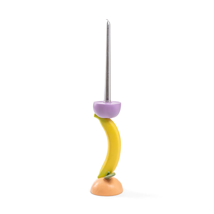 Seletti Vitamin Banana Candlestick, candlestick of a banana stem on a peach base with a purple aubergine cup, taper fitted