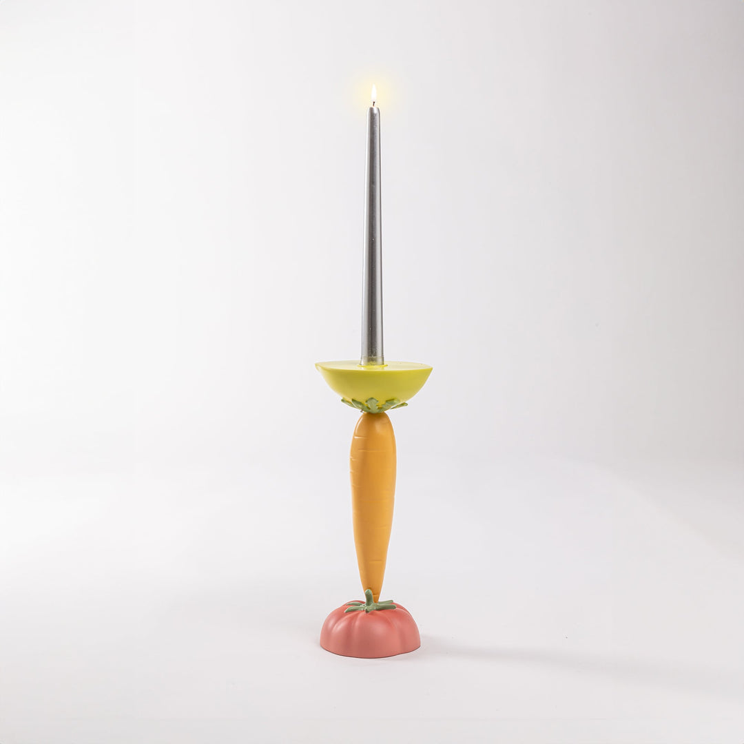 Seletti Vitamin Carrot Candlestick, the carrot candlestick with its taper lit