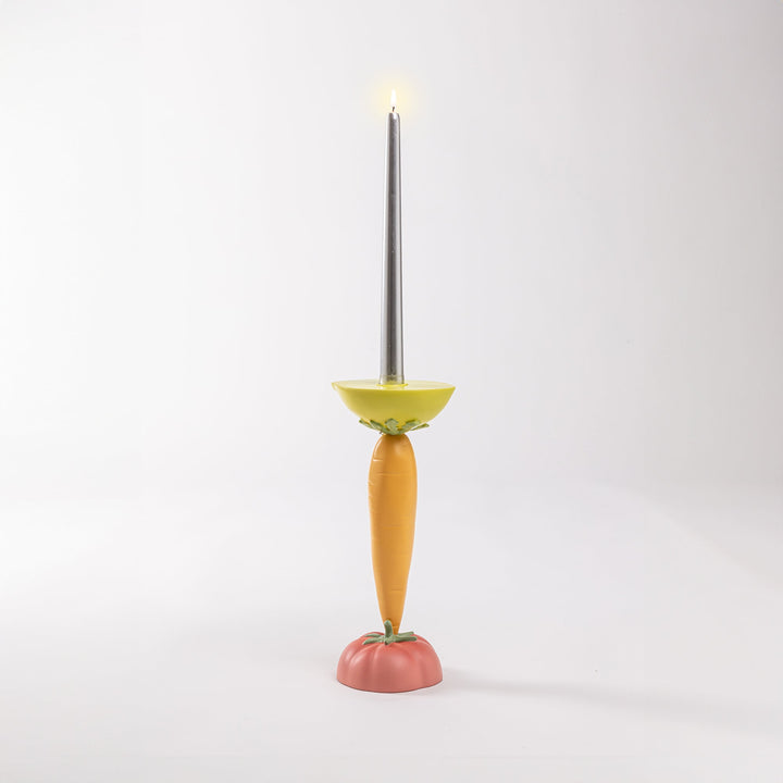 Seletti Vitamin Carrot Candlestick, the carrot candlestick with its taper lit