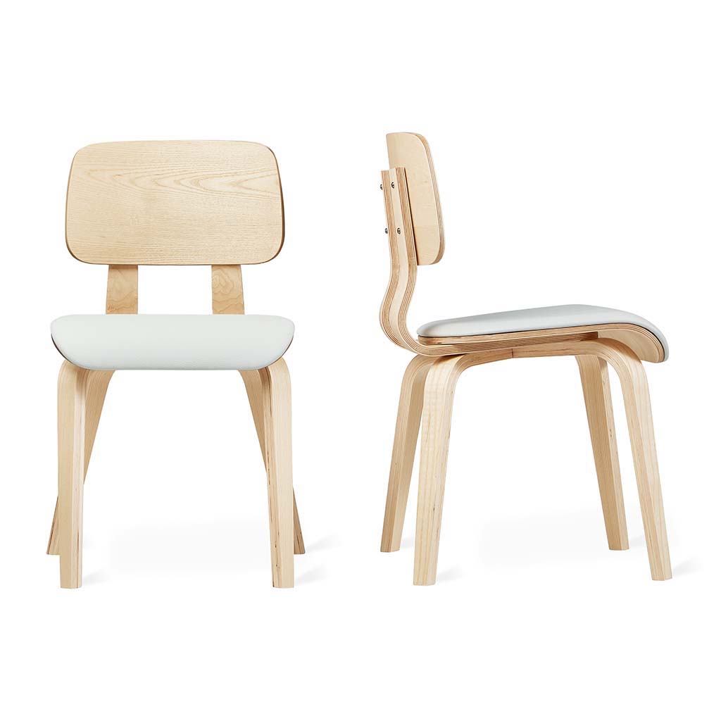 Bentwood dining chair with white upholstered seat, showcasing sculptural plywood frame and minimalist design.