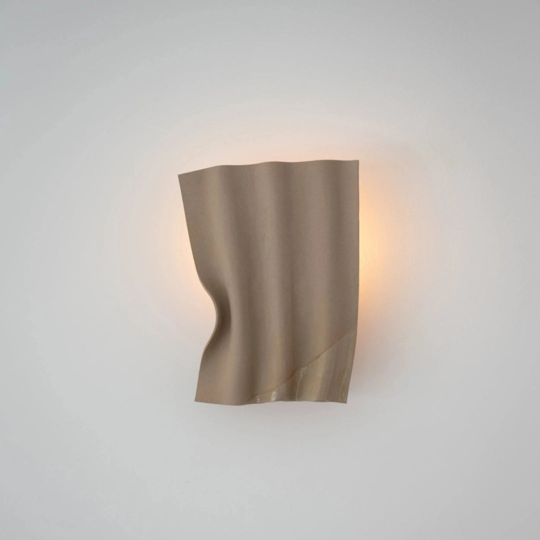 Drape Ceramic & Brass Wall Light — Glaze Highlight — Toffee stoneware, angled view with lit brass sconce