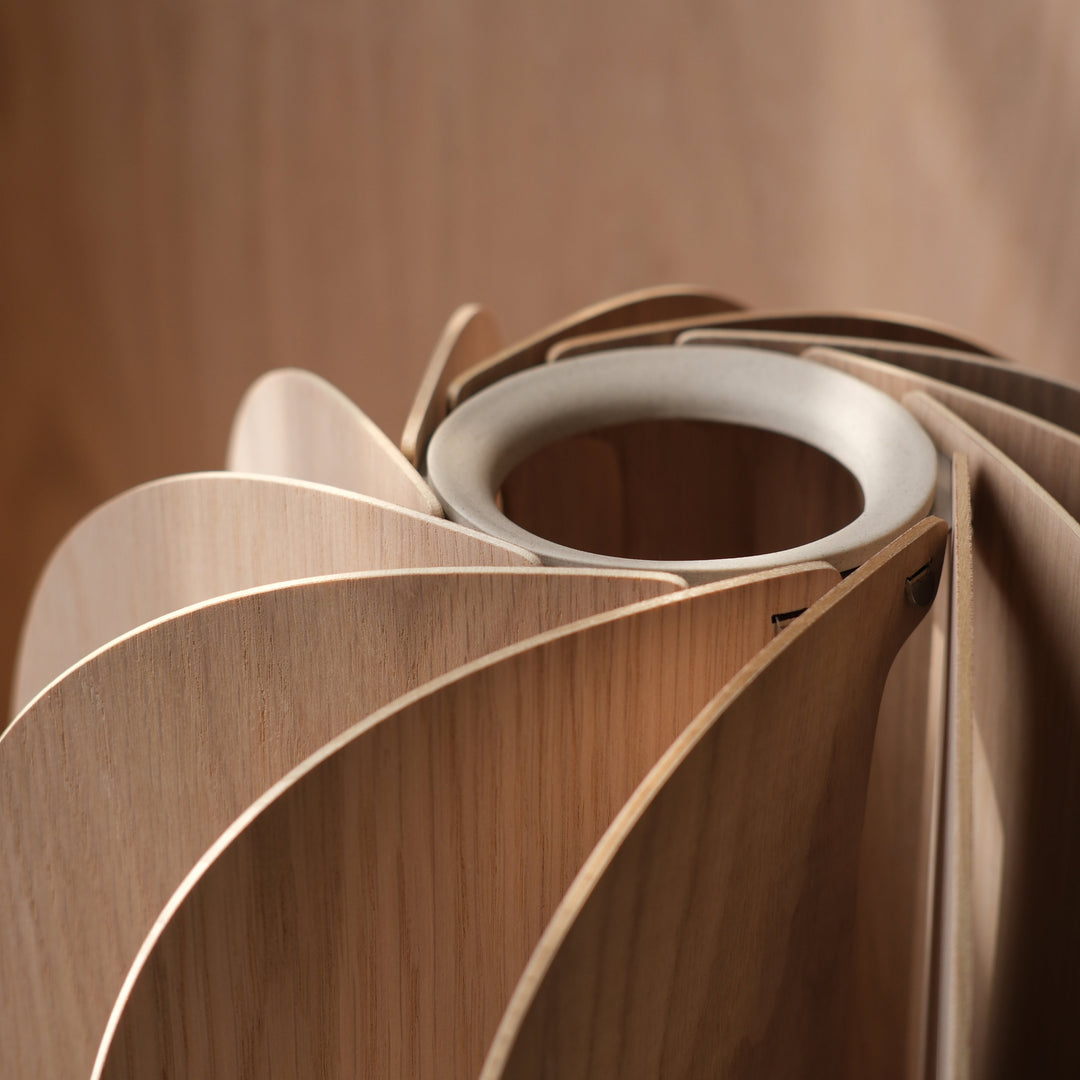 Elegant wooden vase with layered petal design, showcasing natural grain and refined craftsmanship