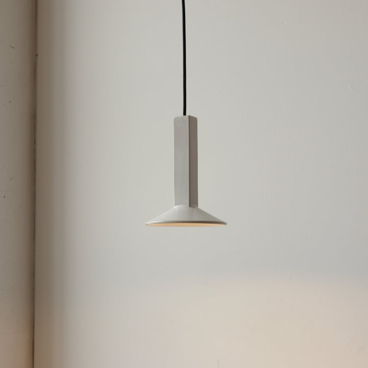 Minimalist white ceramic pendant light with sleek geometric design