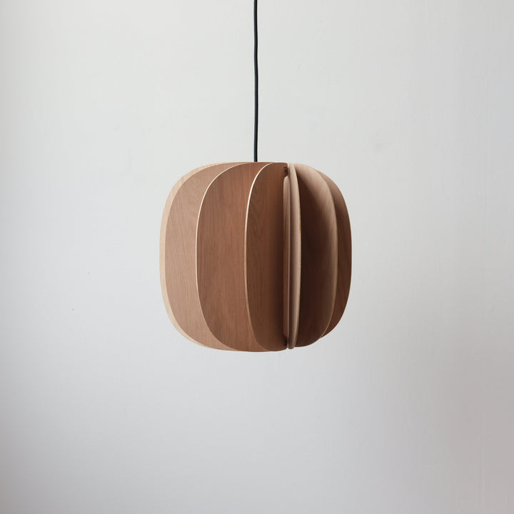 Sleek wooden pendant light with layered design, suspended by black cord
