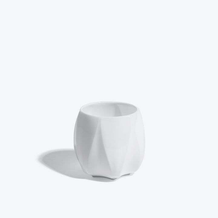 Folio Vessel, Set of 4 — small white faceted porcelain vessel, front view on a white background