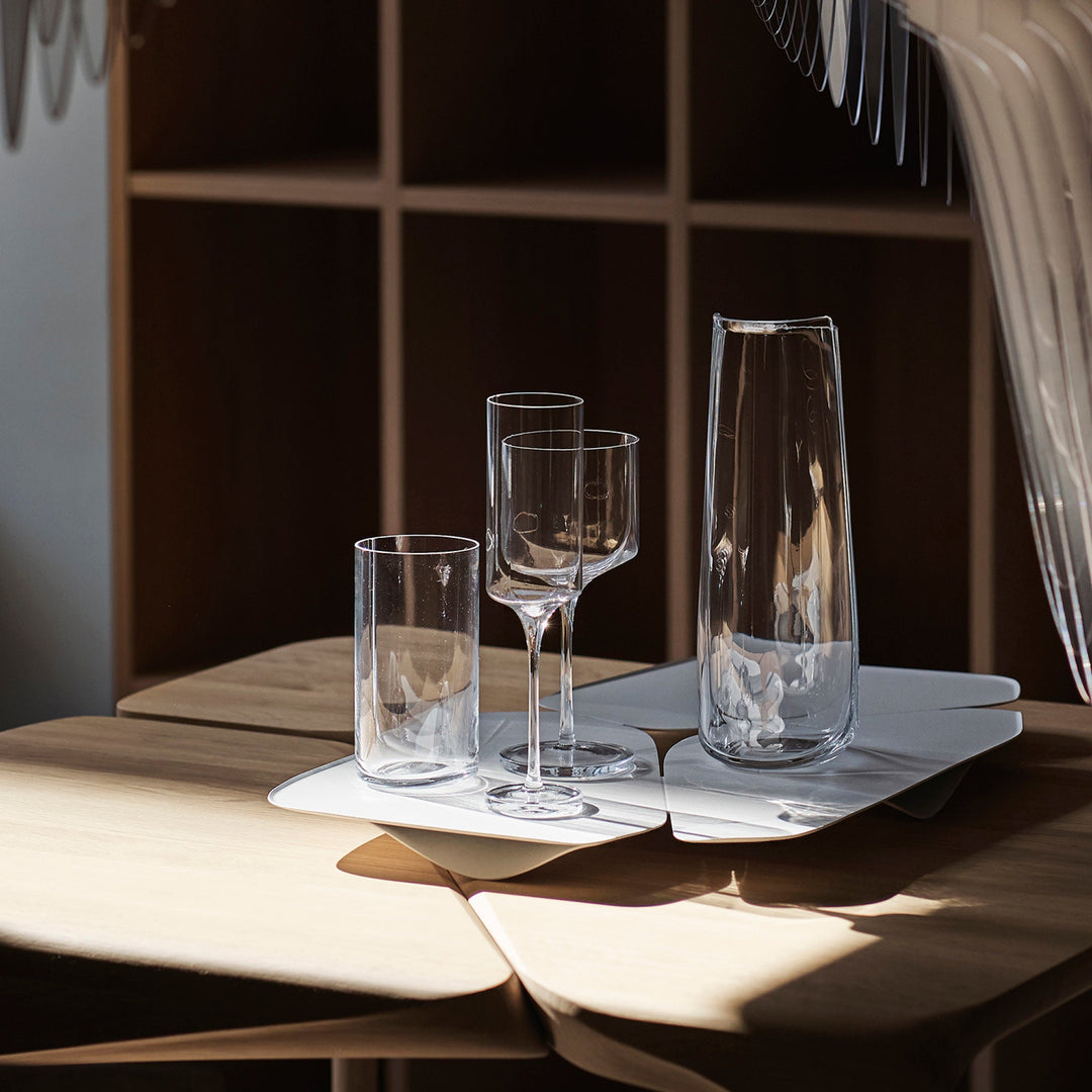 Hew Carafe — Clear carafe and glasses on a white tray on a sunlit oak table