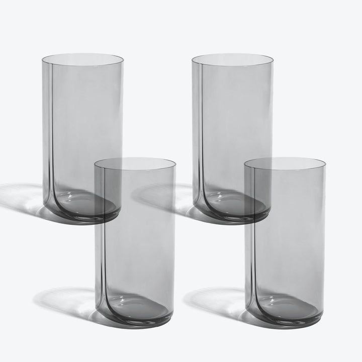 Hew Highball Glass, Set of 4 — four smoke-tinted highball glasses arranged in two rows