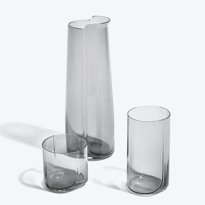 Hew Highball Glass, Set of 4 — smoke highball glass shown with the matching carafe and tumbler on a white background
