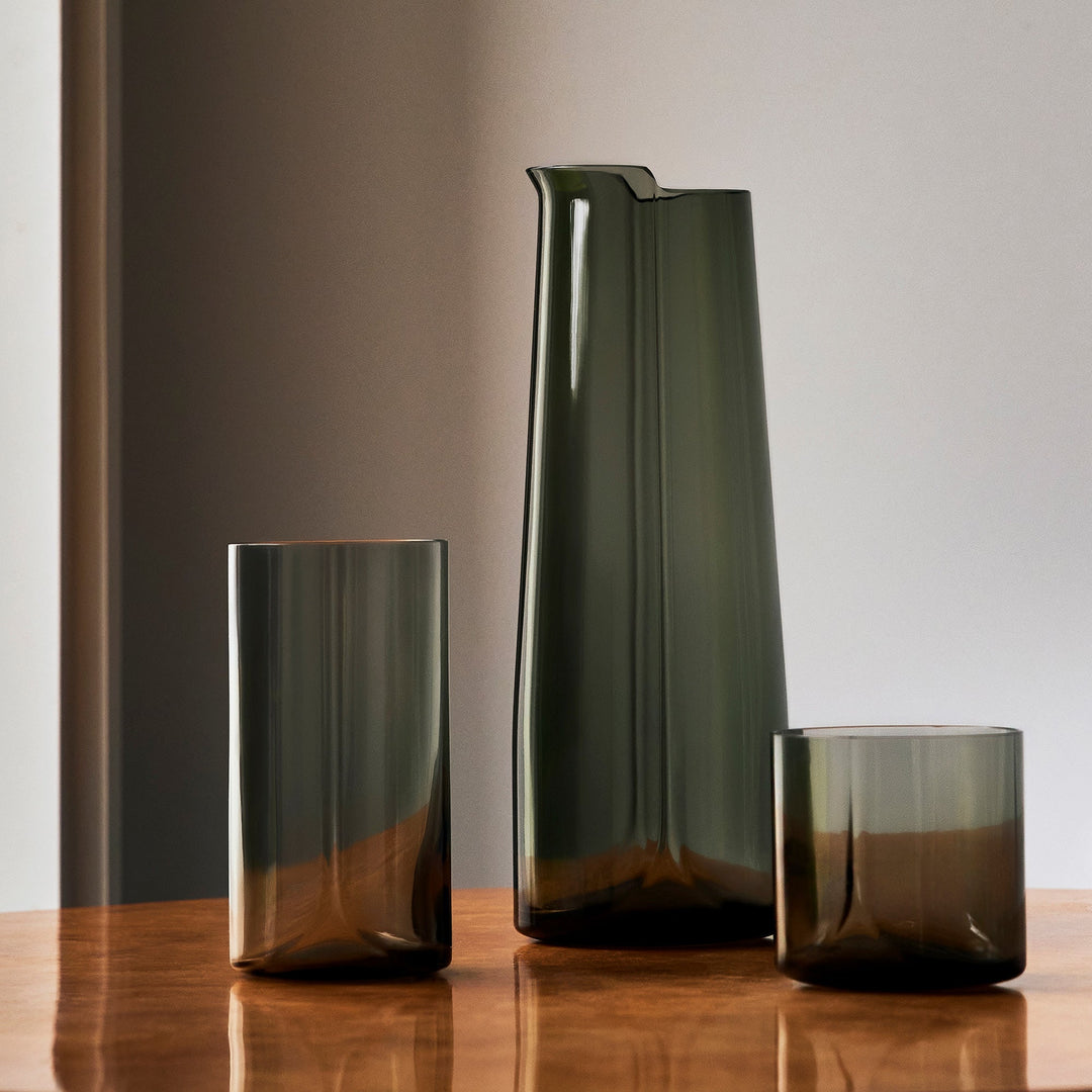 Hew Highball Glass, Set of 4 — smoke highball glass with a matching carafe and tumbler on a wooden table