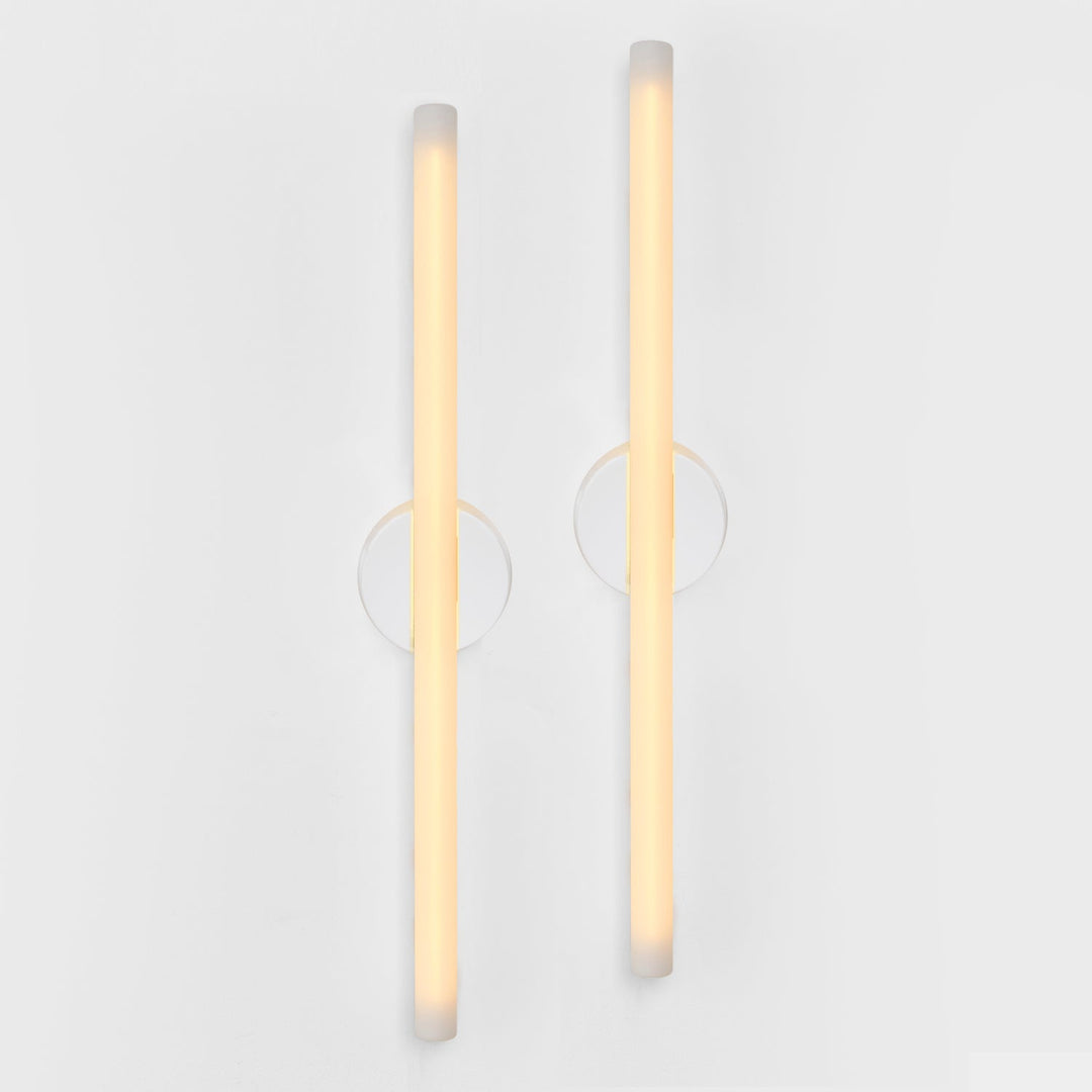 Modern frosted glass wall sconces with gold accents, minimalist designer lighting