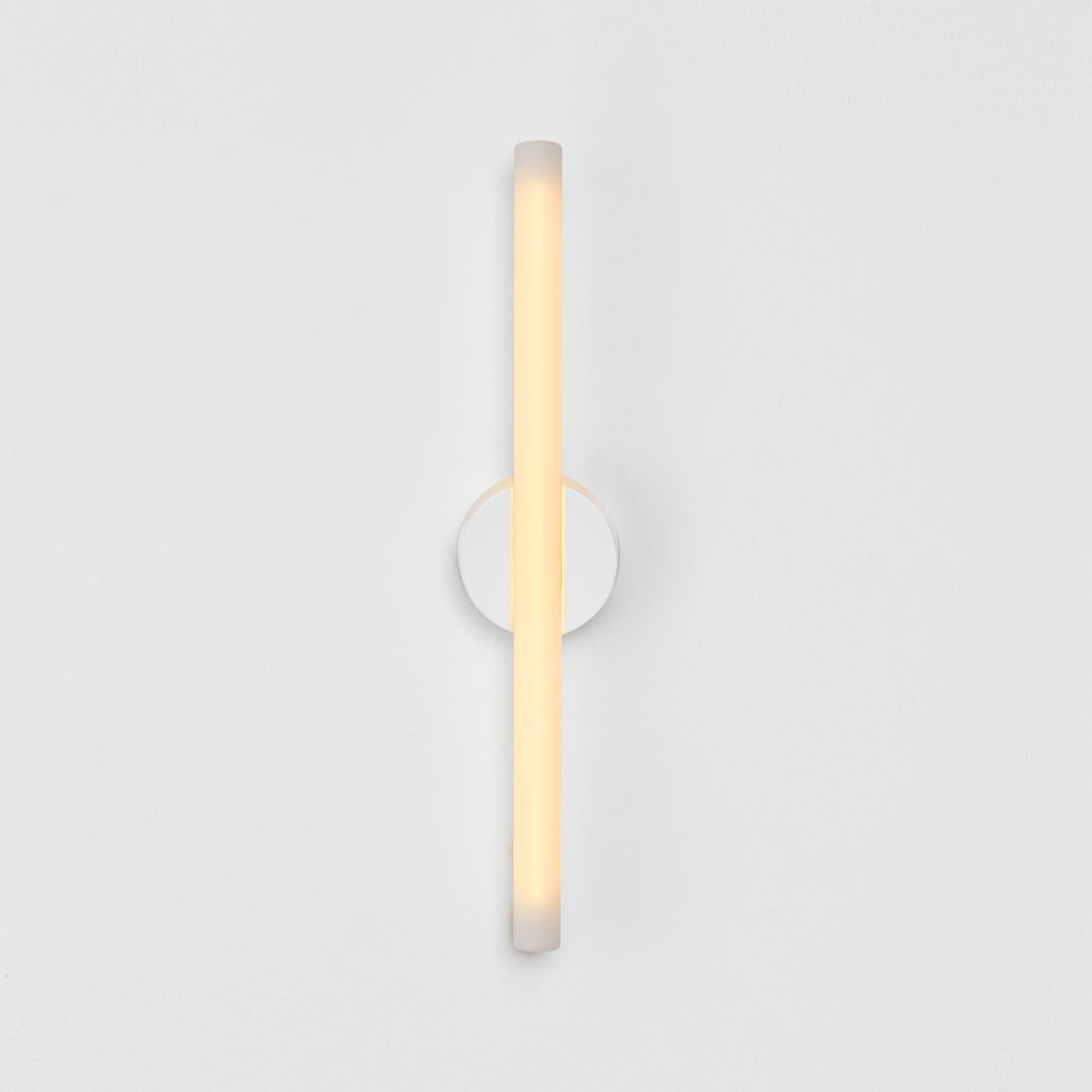 Minimalist frosted glass wall sconce with warm ambient glow, modern designer lighting for contemporary interiors