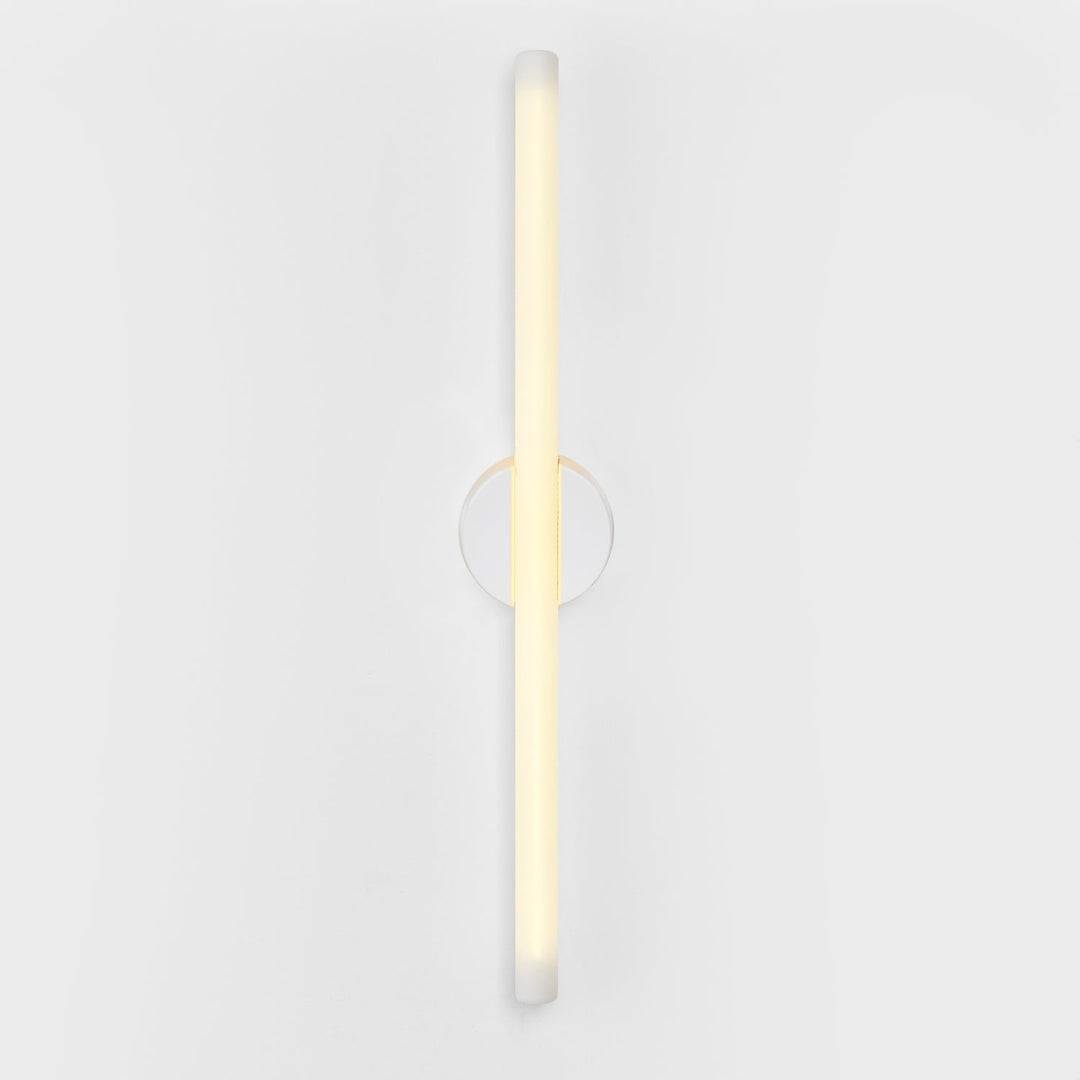 Modern frosted glass wall sconce with minimalist circular accent, elegant ambient lighting design