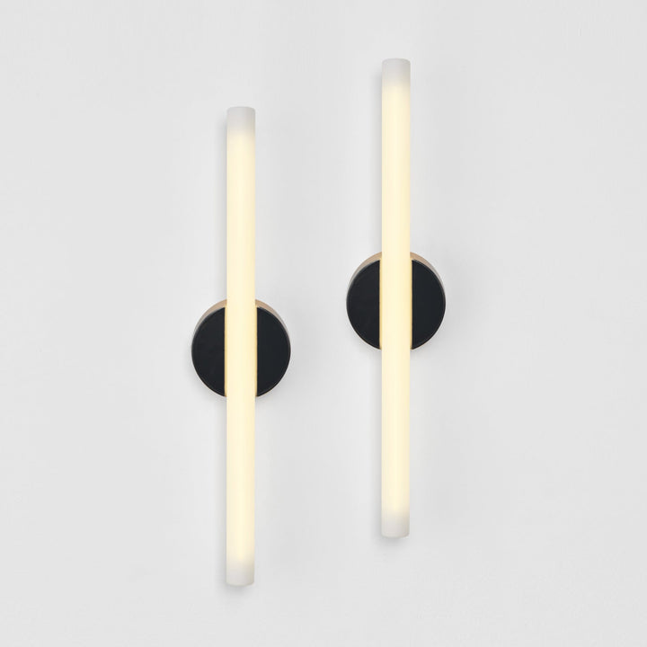 Modern wall sconces with frosted glass and matte black circular mounts