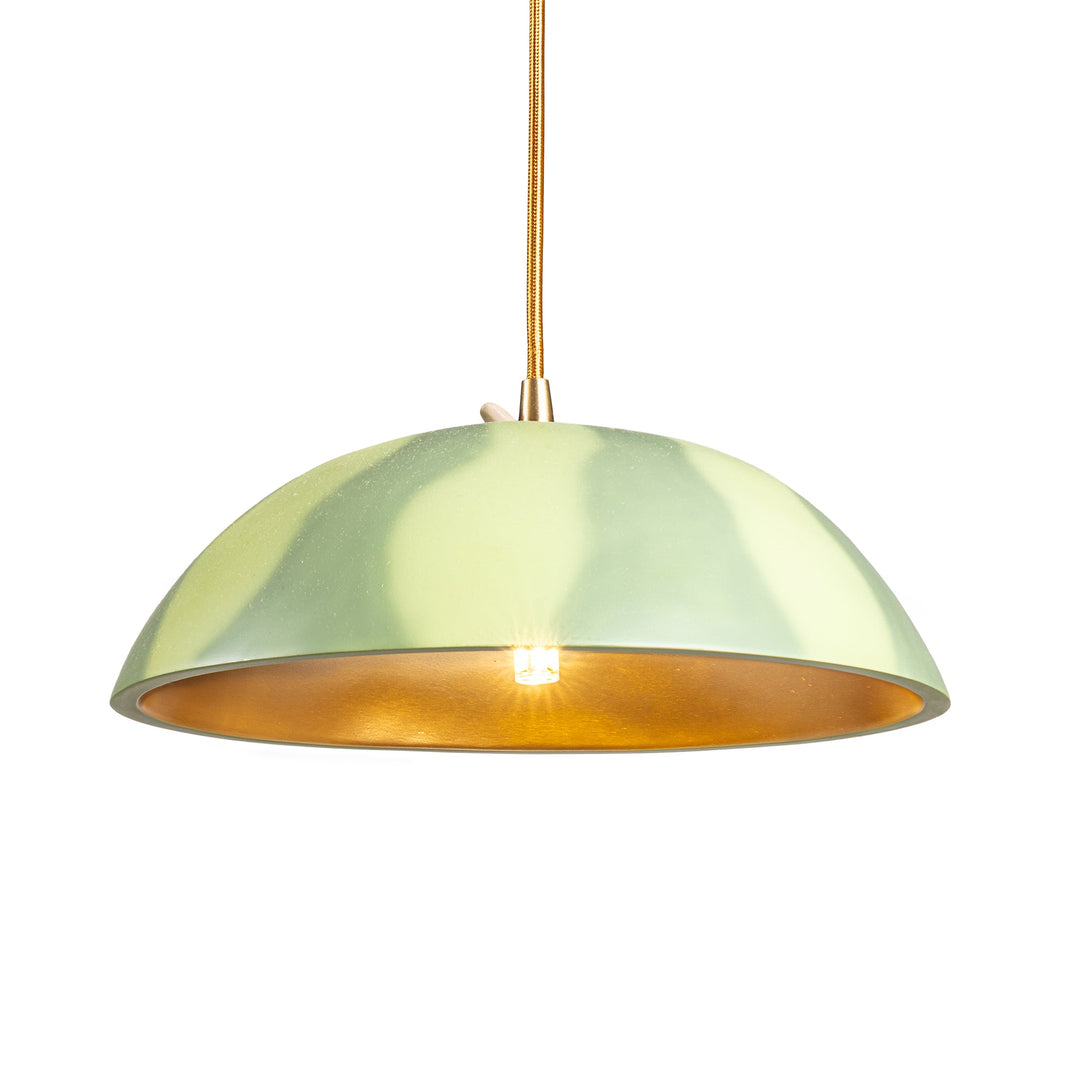 Seletti Vitamin Watermelon Pendant Lamp, the watermelon pendant lit, bulb visible inside
