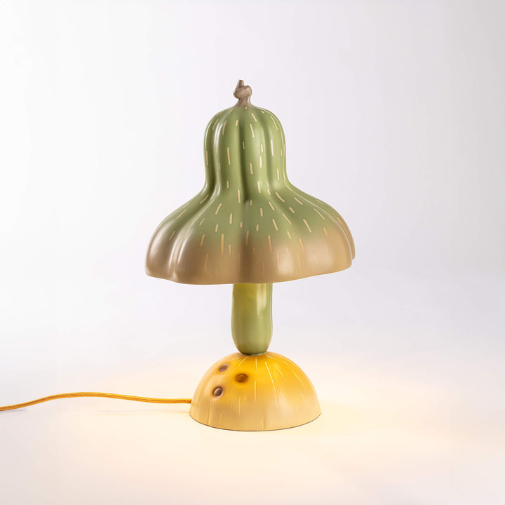 Seletti Vitamin Pumpkin Table Lamp, the gourd lamp lit on a pale backdrop
