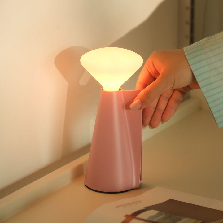 Pink ceramic table lamp with soft glow, modern designer lighting for elegant home decor