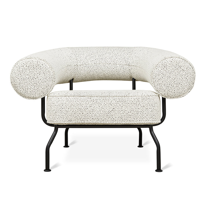 Elegant speckled armchair with black metal frame, designer home furnishing