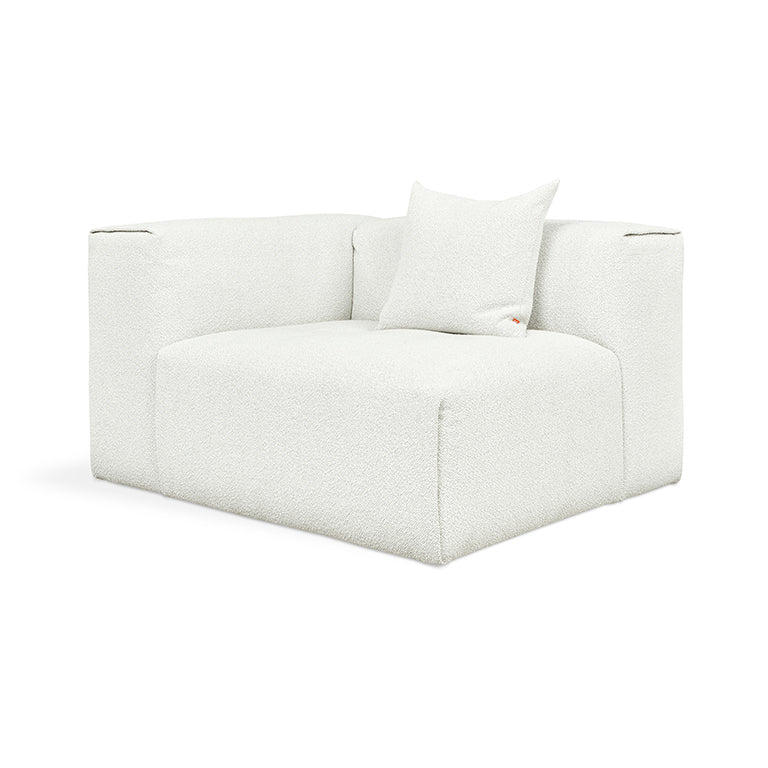 White bouclé armchair with plush cushion, modern minimalist design