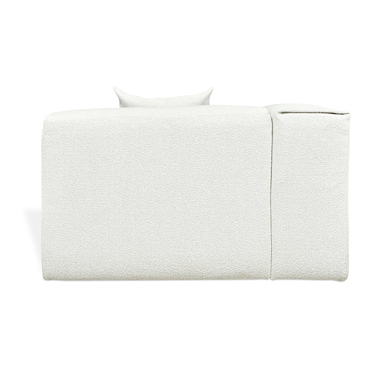 Elegant white textured sofa with minimalist design and plush cushions
