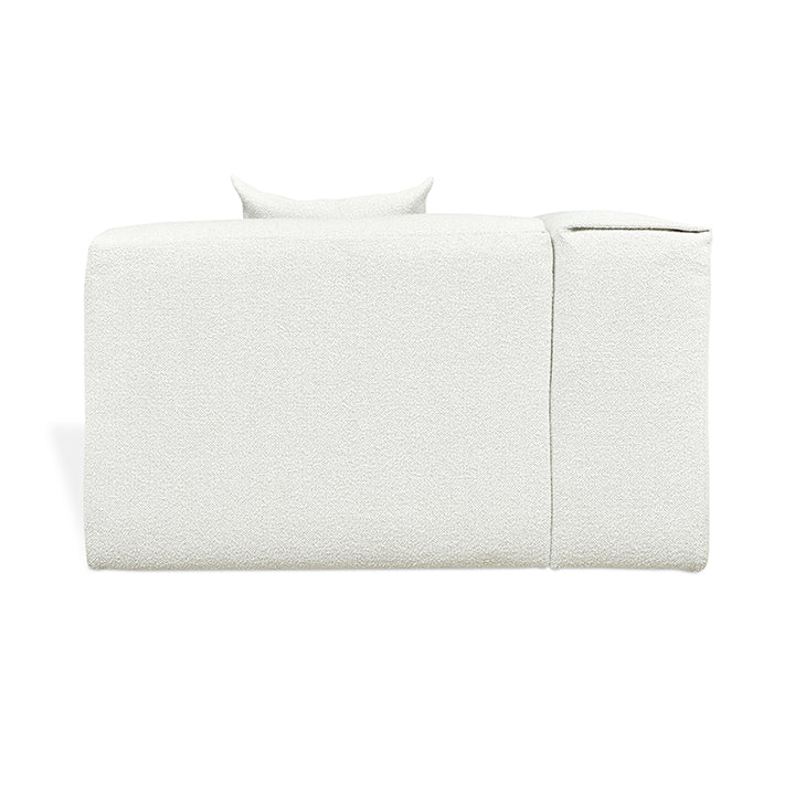 Elegant white textured sofa with minimalist design and plush cushions