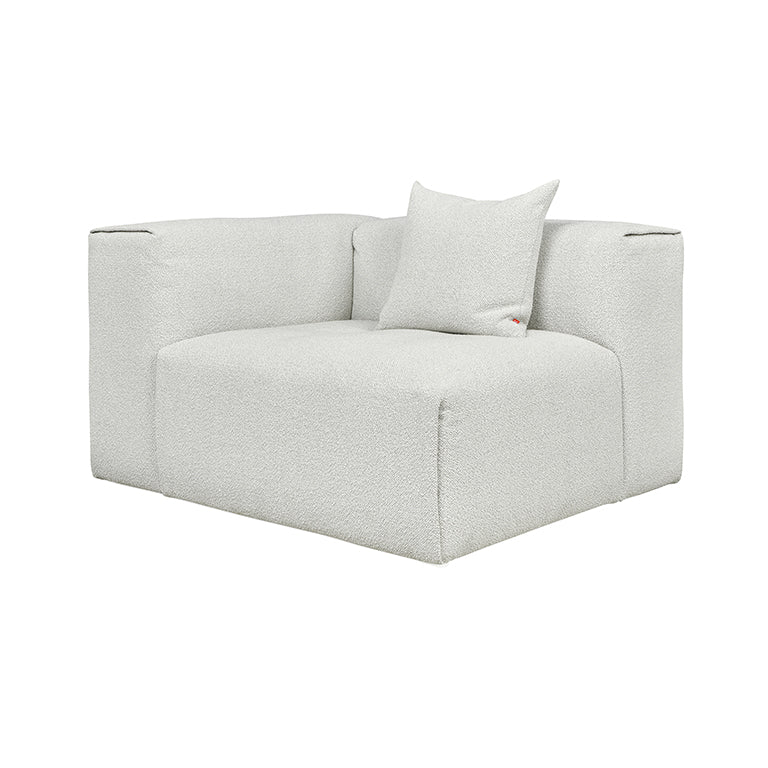 Textured white bouclé armchair with minimalist design and plush cushion