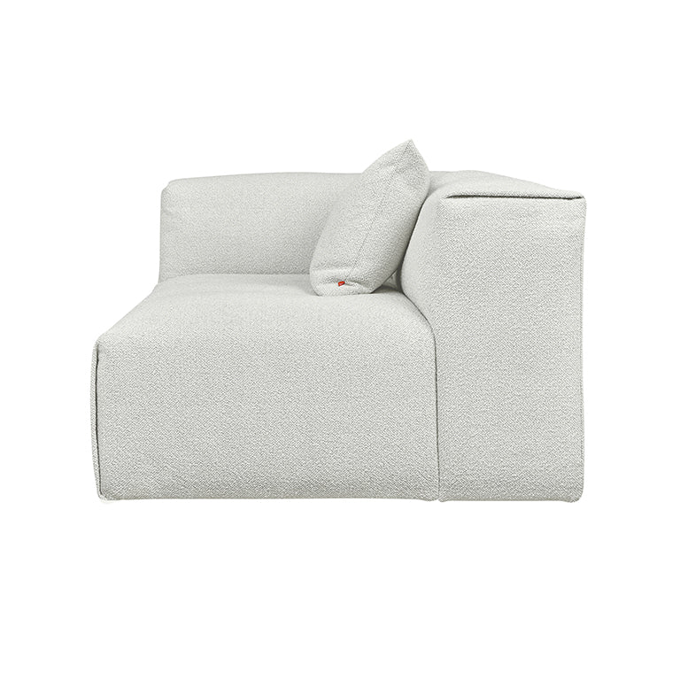 Textured white modular sofa with designer cushion, elegant home furnishing