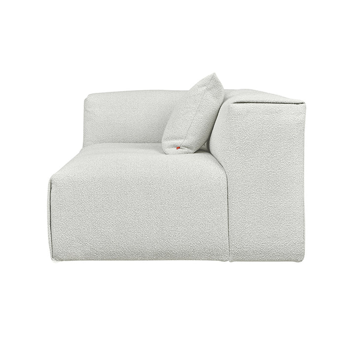 Textured white modular sofa with designer cushion, elegant home furnishing