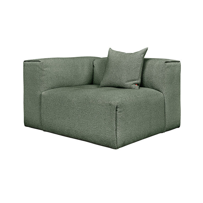 Sleek sage green modular sofa with textured fabric and designer cushion
