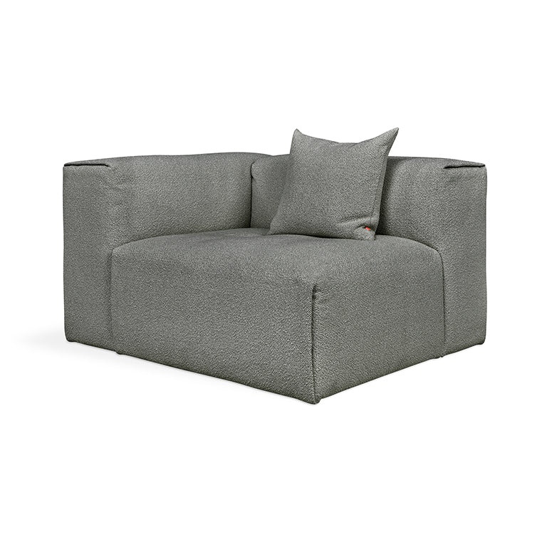 Gray textured modular sofa with designer cushion, elegant home furnishing