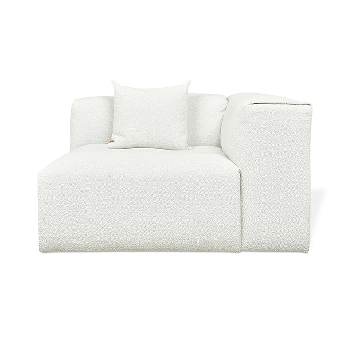White bouclé armchair with minimalist design and plush cushion