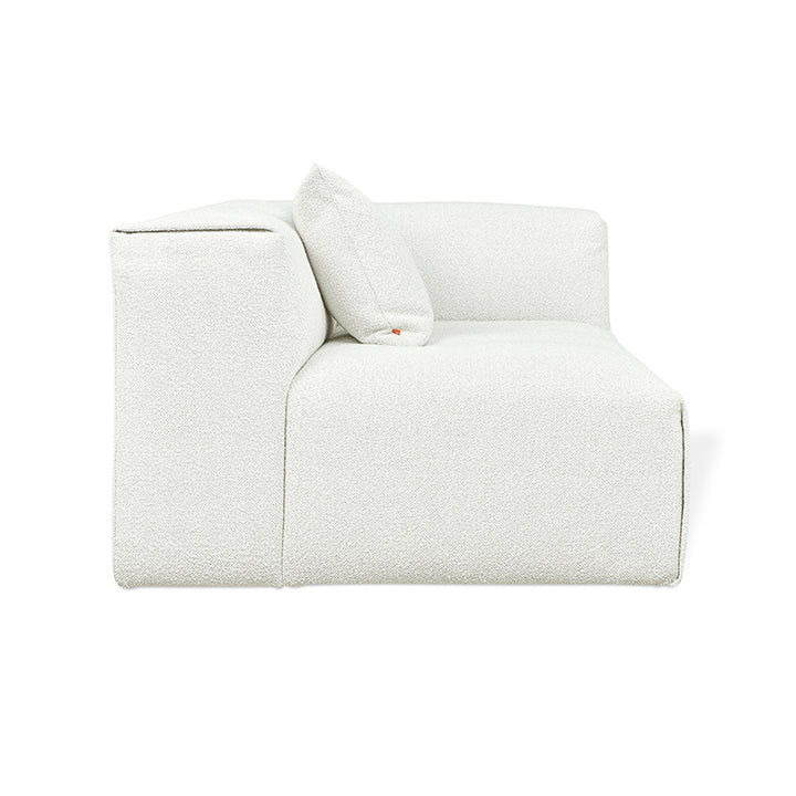 Elegant white textured modular sofa with designer cushion, minimalist luxury furnishing