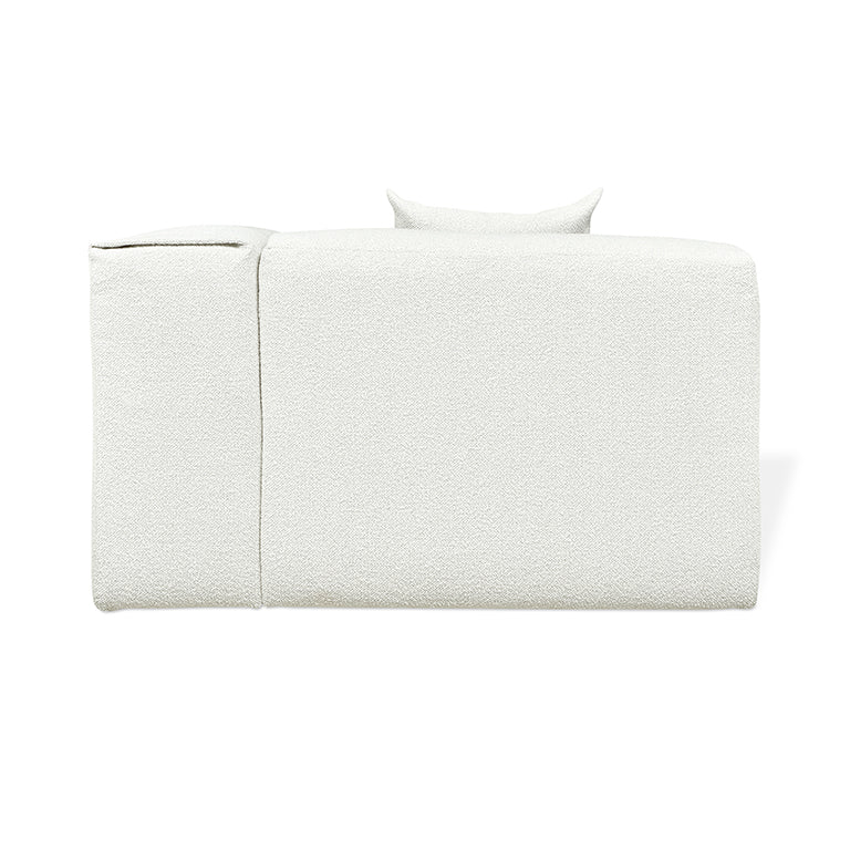 Textured white linen daybed with minimalist design and sculptural pillow, modern luxury furniture