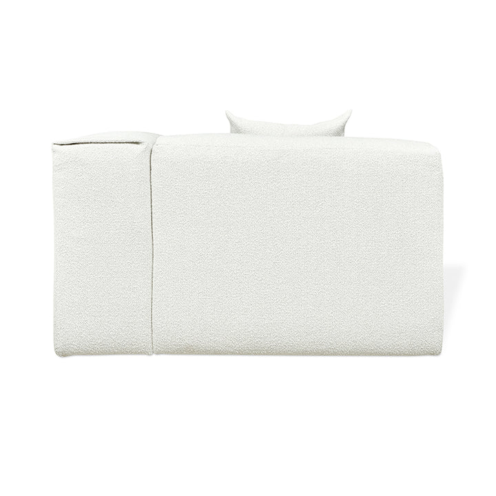 Textured white linen daybed with minimalist design and sculptural pillow, modern luxury furniture